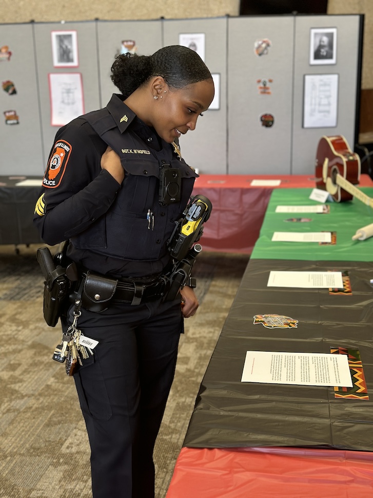 Campus security officer looking at event table display